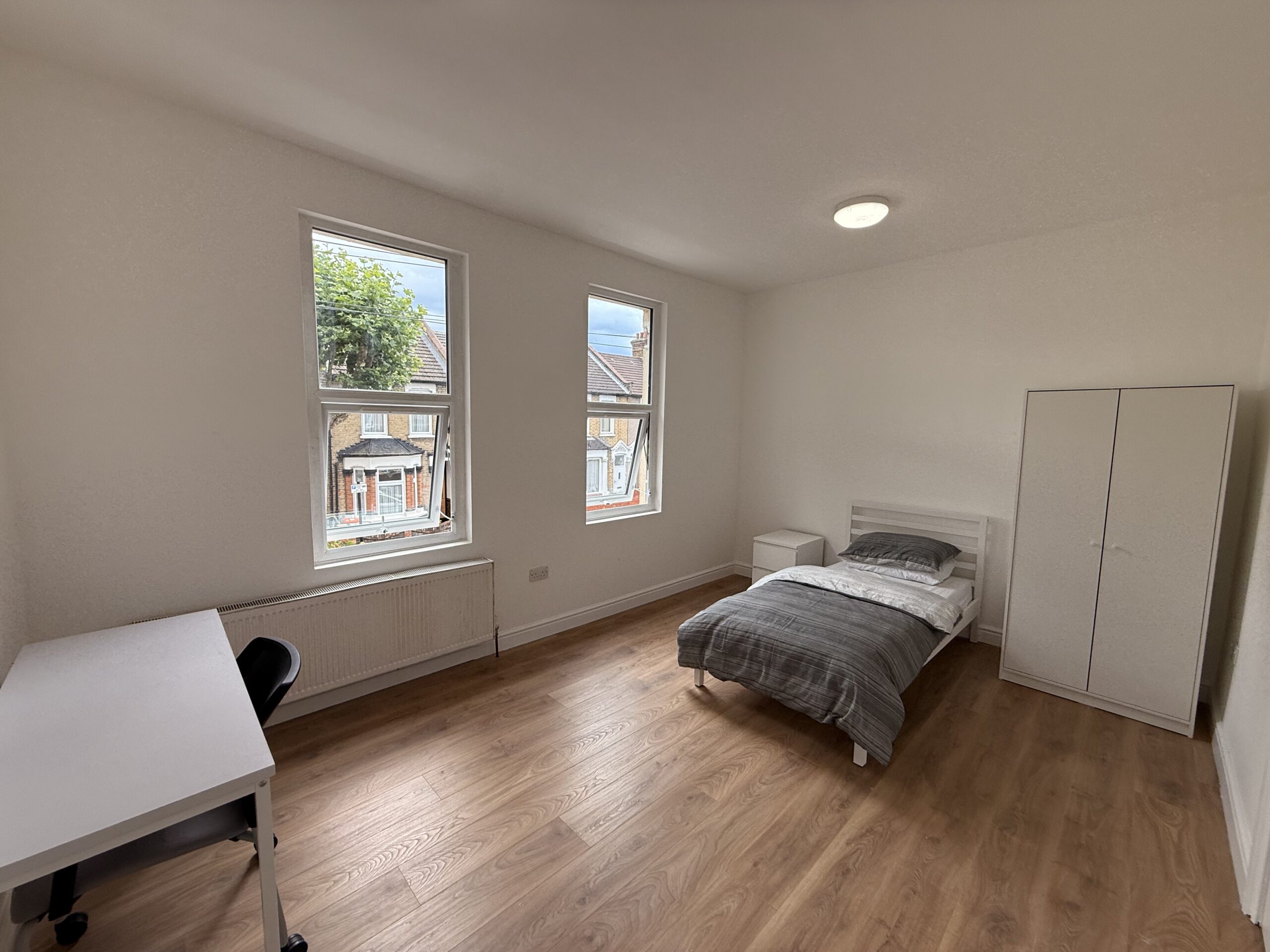 Bedroom 3 with bed, side table and window