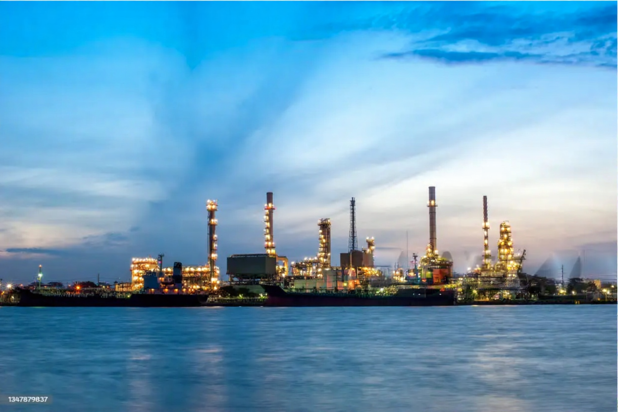 Wide shot of refinery corridors and lighting